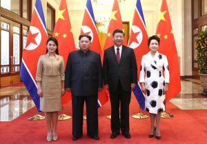 Xi Jinping and his wife Peng Liyuan (R) with Kim Jong Un and his wife Ri Sol Ju (L) at the Great Hall of the People in Beijing, March 2018. (Image credit Twitter/@PDChina)
