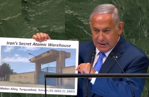 Benjamin Netanyahu displaying a visual document of what he claims is the location of Iranian secret atomic warehouse/site.