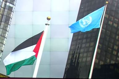 Palestine flag (L) flies along sided the UN's at the UN HQ