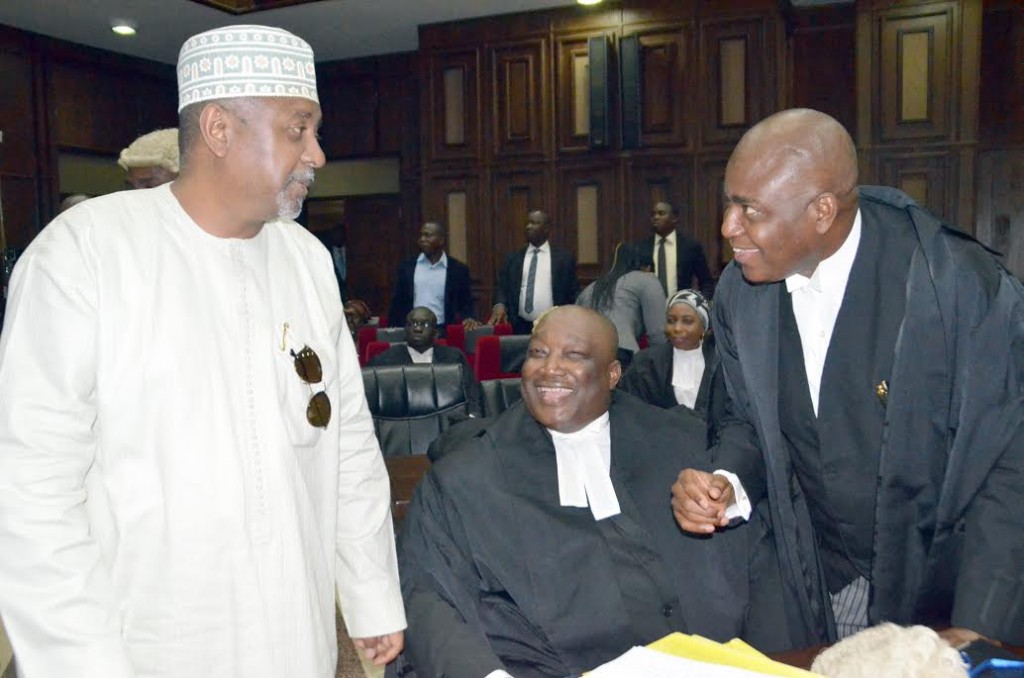 Nigeria Ex-National Security Adviser Sambo Dasuki (L) with his lawyers' in court over 'fraud' - arms purchase scandal