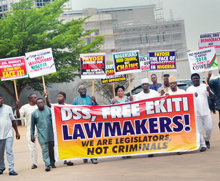 Members of Ekiti State House of Assembly protesting at the American Embassy, Abuja, over the arrest of four members of the state legislature by operatives of the DSS, 16 March 2016. (Image credit Sunday Osunrayi)