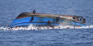 A boat carrying migrants was pictured as it capsized; it overturned seemingly as people on board moved towards one side after spotting a rescue ship, May 2016