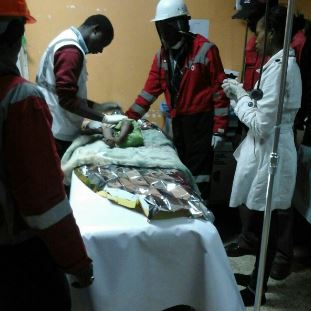A child was rescued at the collapsed building in Huruma, Nairobi, Kenya, 2 May 2016. (Image credit @KenyaRedCross / Twitter)