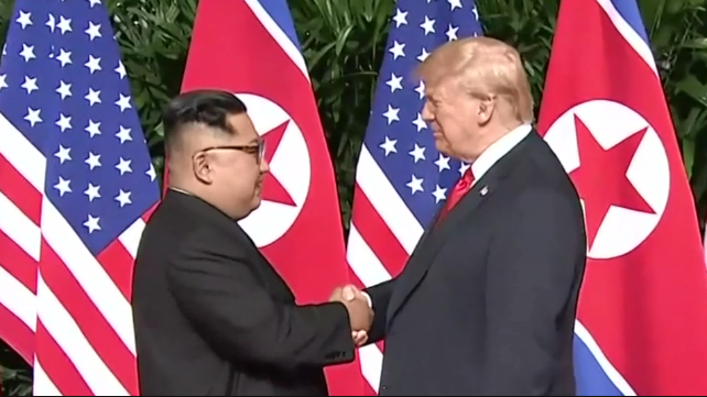 Kim Jong-Un (L) and Donald Trump, meet for a nuclear summit in Singapore, June 2018