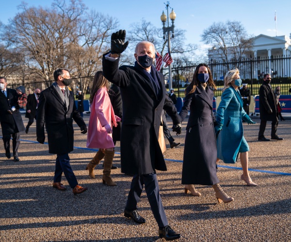 President Joe Biden and First Lady Dr. Jill Biden walk along Pennsylvania Avenue in front of the White House during Inaugural celebrations, Wednesday, Jan. 20, 2021. President Biden was sworn in as as the 46th President of the United States. (Photo by Doug Mills/The New York Times)