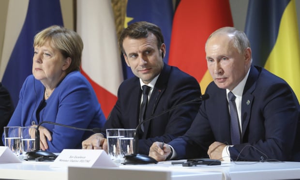 Angela Merkel, Emmanuel Macron, left and centre, have sugggested an EU summit with Russian president Vladimir Putin. Photograph: Ludovic Marin/AP